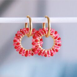 Oorrel met ronde gefacetteerde hanger - sorbet/bordeaux