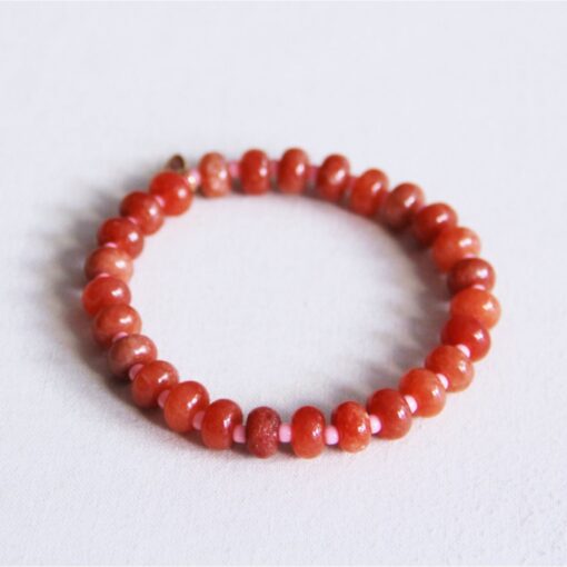 Elastische armband met edelstenen - oranje/roze
