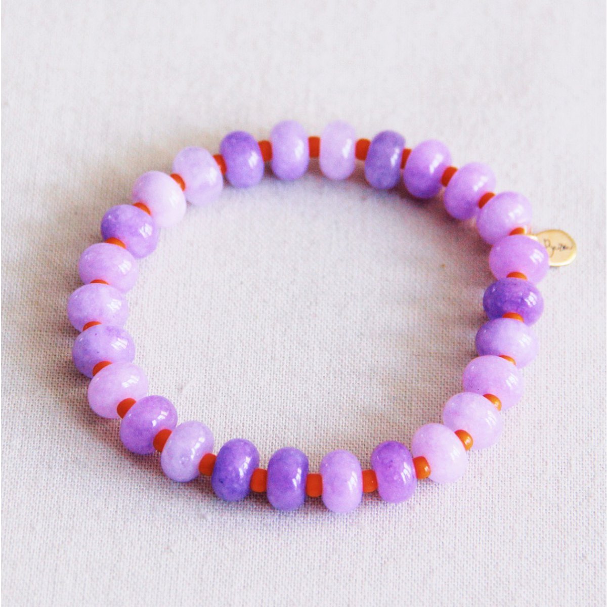 Elastische armband van edelstenen - lila/oranje