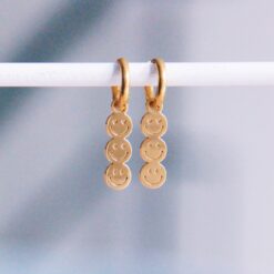 Roestvrijstalen oorringen met 3 smileys β goud