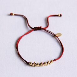 Satijnen armband met goudkleurige kralen - BourgondiΓ«