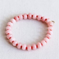 Elastische armband met edelstenen - lichtroze/rood